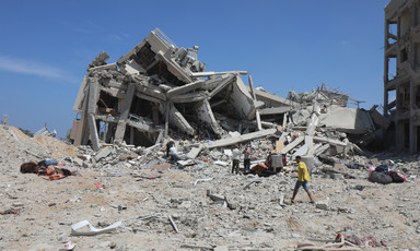 A collapsed home in the daytime