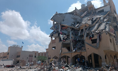 A bomb damaged building stands in ruins