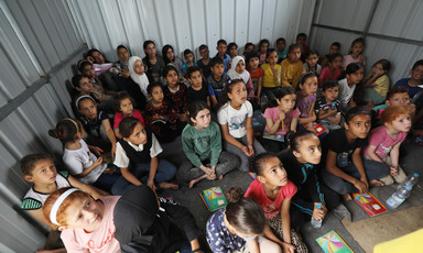 children crowded together during a lesson