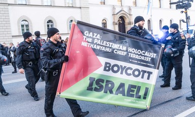 German police confiscate a banner saying Gaza: The Palestinian Holocaust and Netanyahu: Chief Terrorist 