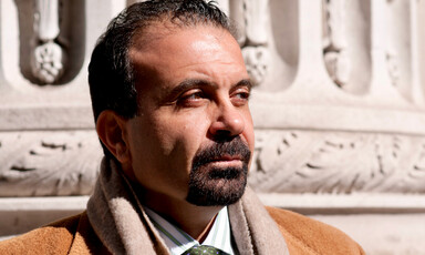 Portrait of Joseph Massad standing in front of neoclassical building