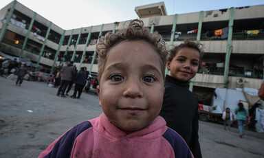 Two children in a Gaza school that has become a shelter for displaced people 
