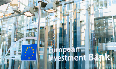 A facade with a blue and yellow logo and the words European Investment Bank