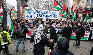A banner reading One genocide does not justify another is held up at a demonstration in Berlin