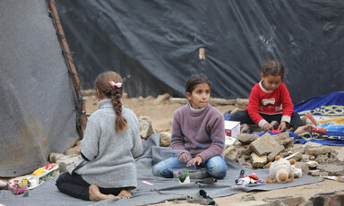 Children play on the ground.