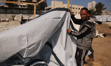 A man cconstructs a shelter