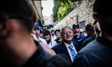 National security minister Itamar Ben-Gvir marches with a crowd through the Muslim Quarter in the Old City of Jerusalem
