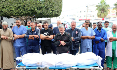 doctors perform funeral rites for a colleague