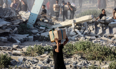 A man carries a box on his head
