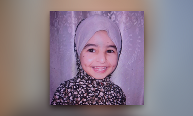 A portrait of a girl wearing a headscarf