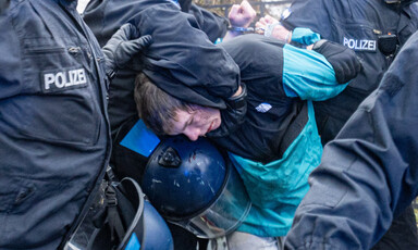 BERLIN, GERMANY - DECEMBER 27: Police detains a demonstrator as protesters march in support of Palestinians after gathering in front of Neukolln City Hall (Rathaus Neukolln) in Berlin, Germany on December 27, 2025.