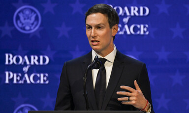 Jared Kushner stands at podium speaking