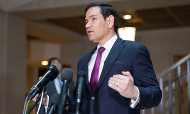 Secretary of State Marco Rubio speaks into multiple microphones in Capitol Building basement