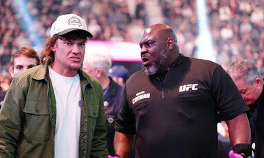Theo Von wears a cap alongside Brad Tate at a UFC event at T-Mobile Arena in Las Vegas, Nevada