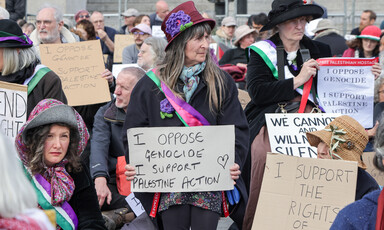 Protestors with signs reading: I oppose genocide. I support Palestine Action,